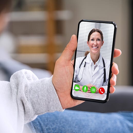 A man is having a virtual doctor appointment from his phone.