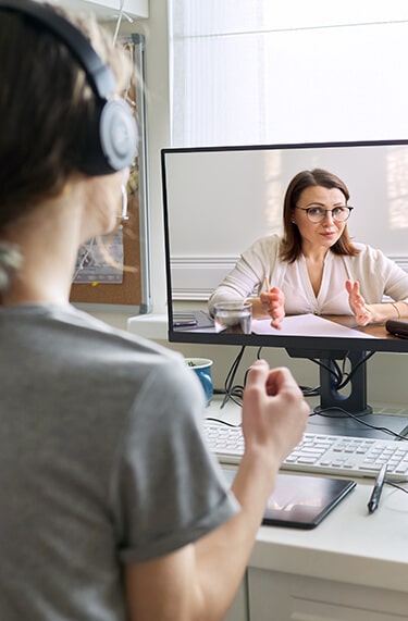 Young woman in medication assisted treatment telehealth session with computer